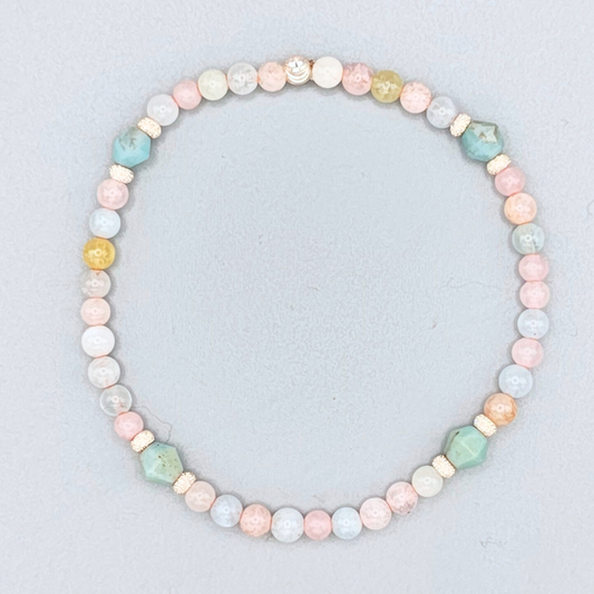 Pastel beaded necklace on a light gray background